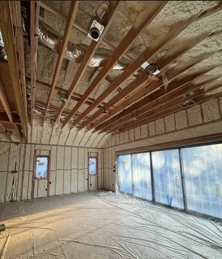 Interior walls and ceiling insulated with spray foam during new construction in Pacific